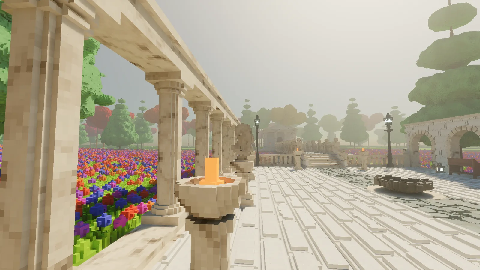 A marble colonnade beside the courtyard paving, with a fire bowl on a pedestal, street lamps and the arcade in the distance.