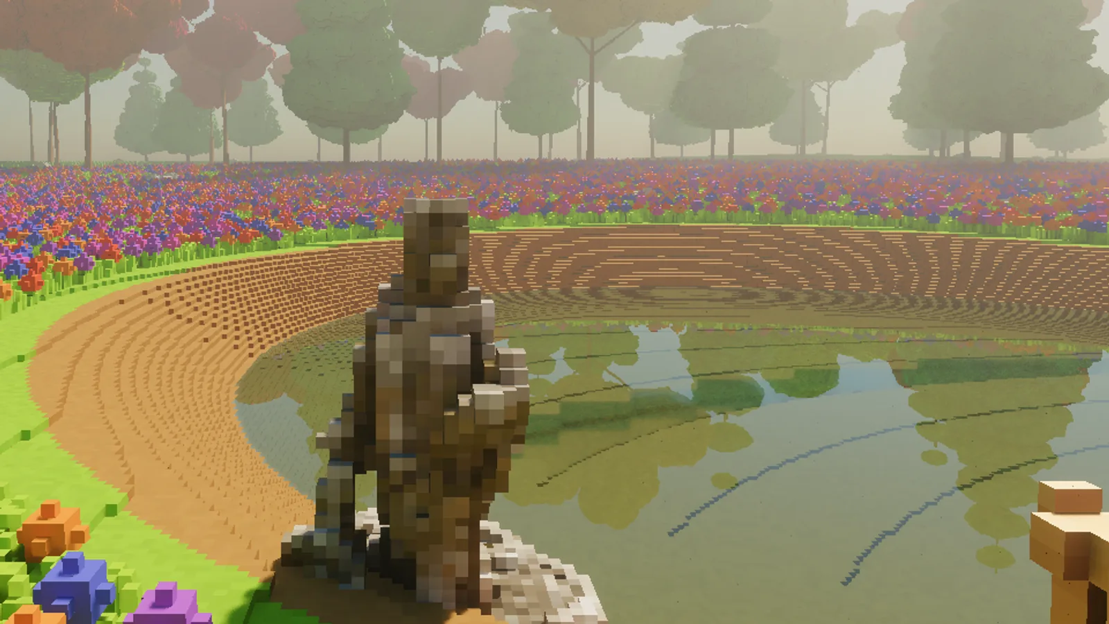 A voxelised stone statue standing on the bank of the pond, its shape and weathered colouring kept at 5 cm.