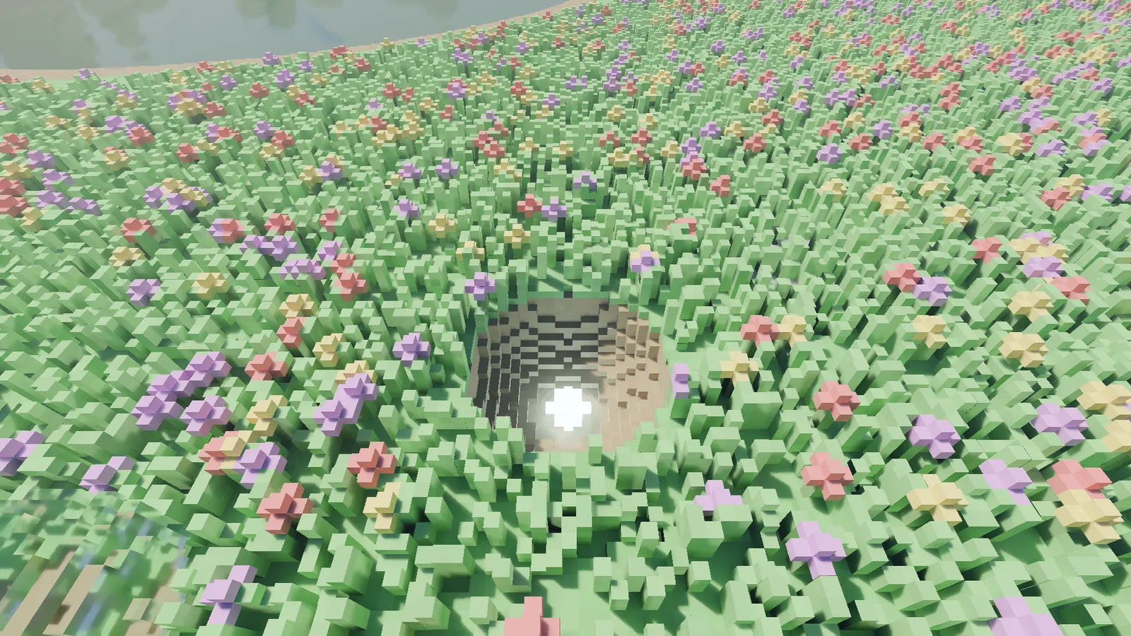 A terraced pit carved into the flower meadow, a glowing lamp placed on its floor lighting the walls.